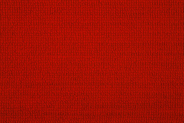 Textile close up of red fabric, fabric texture as a background.