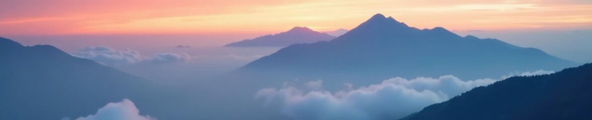 Fototapeta premium Misty clouds shroud the majestic mountain landscape at dawn, misty, clouds