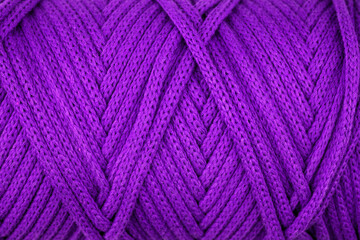 Purple  close up of a roll rope, ropes texture as a background.