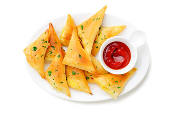 Vegetarian samsa (samosas) with tomato sauce and herbs. Stuffed with potato. isolated on white  background, top view
