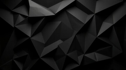 Obraz premium Monochromatic black paper folded into geometric triangles creates an abstract background with a modern feel.