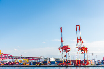 Container port and container crane at Industrial port for cargo container ship Osaka Japan. Business logistic transportation concept.