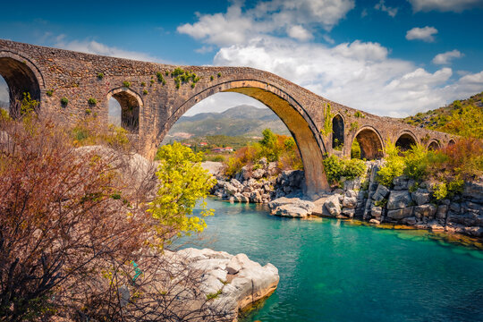 Magnificent spring view of Old Mes Bridge. Gorgeous morning landscape of Shkoder. Breathtaking outdoor scene of Albania, Europe. Traveling concept background.