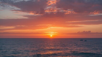 Obraz premium Vibrant sunset over the ocean with colorful clouds and gentle waves