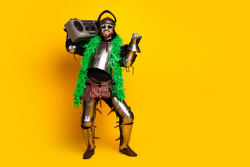 Stylish knight in full armor exudes modern humor with a boombox, green scarf and vibrant yellow background