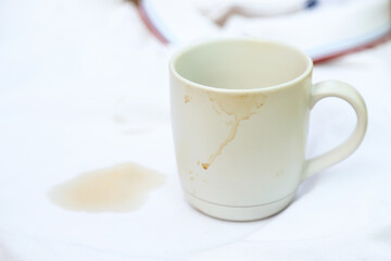 dirty coffee stain on cup from drinking in freetime. stain for cleaning concept
