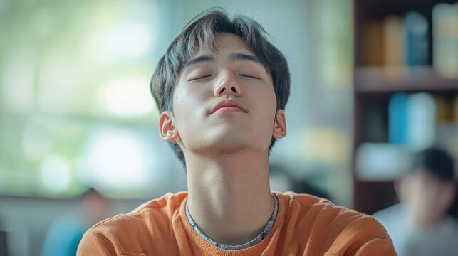 A student practicing deep breathing techniques to avoid hyperventilation before an important exam