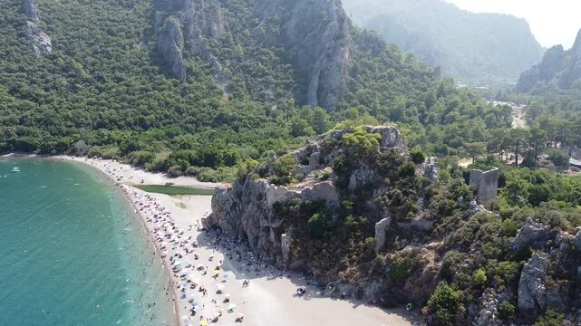 Tilting down drone footage of the Olimpos Beach on a sunny day in the province of Antalya, Turkey