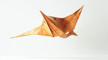 Fototapeta premium A brown origami pterodactyl bird flying in the air on display