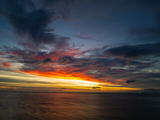 aerial view beautiful sky in sunset at horizon at Kata beach Phuket Thailand. .Scene of colorful red sky in sunset..Gradient color. Sky texture, abstract nature background.