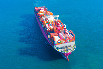 Fototapeta premium Aerial view of International Containers Cargo ship in the blue ocean,Freight Transportation,Shipping,Nautical Vessel. Logistics import export Container Cargo ship over sea. OverseaTransport business.