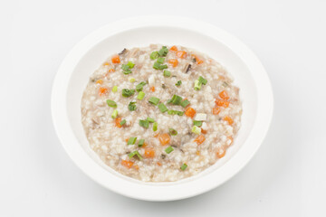  Sun porridge with meat and vegetables. Stir-fry chopped green onions and vegetables, then add rice and fry until golden brown, then add marinated meat and simmer.