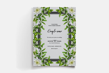 WEDDING INVITATION FRAME WITH FLOWER DECORATIONS AND FRESH LEAVES