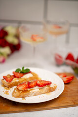 Bruschetta with strawberries. fried in batter toast with cream cheese
