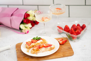 Bruschetta with strawberries. fried in batter toast with cream cheese