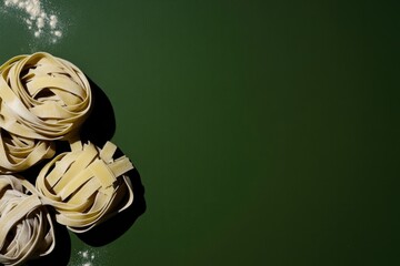 Colorful arrangement of rubber bands on dark green surface, show