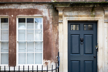 Old house front with door and window