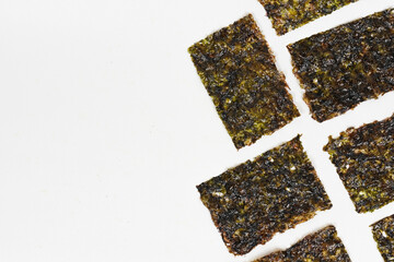 Delicious nori seaweed isolated. Crispy nori seaweed on white background.