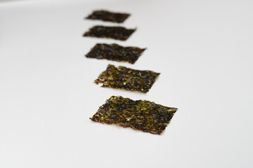 Delicious nori seaweed isolated. Crispy nori seaweed on white background.