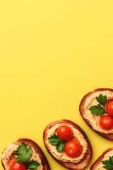 Bright yellow backdrop highlights delicious toasted bread topped