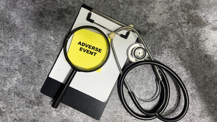 Concept of Adverse Event write on sticky notes isolated on Wooden Table.