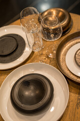 Close up on luxury italian tableware, dishes and glasses.