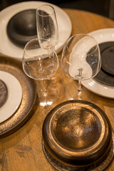 Close up on luxury italian tableware, dishes and glasses.