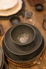 Close up on luxury italian tableware, dishes and glasses.