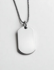 Fototapeta premium Personalized engraved dog tag necklace on a white background.