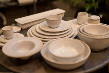 Close up on luxury italian tableware, dishes and glasses.