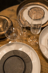 Close up on luxury italian tableware, dishes and glasses.