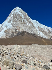 Nepali brown mountain with high snowy mountain in the background