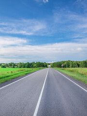 Fototapeta premium Long road with a clear blue sky above it