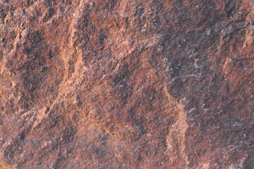 A close-up of a red and orange rock