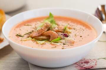 prepared fish soup puree. Red fish soup puree, dietary. On a light wooden table