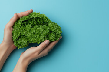 Concept écologique : voiture verte formée de feuilles sur fond bleu clair.