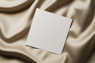 Blank canvas resting on soft fabric creates serene and minimalis