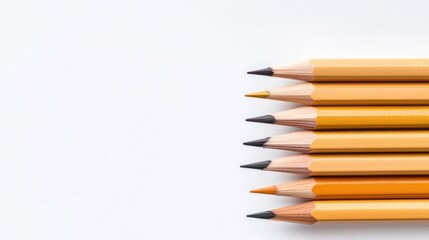 Obraz premium Colorful pencils arranged neatly on white background create vibr