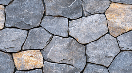 Obraz premium Durable Stone Wall Texture Background Material in Grey and Tan Hues for Construction Design
