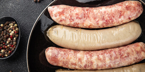 sausages raw meat pork, beef, chicken, lamb fresh tasty food dish gourmet food background on the table rustic food top view copy space