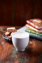 Cappuccino on dark wooden background. Soft focus. Close up.