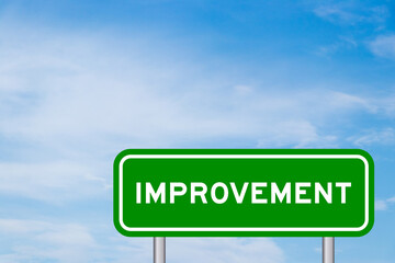 Green color transportation sign with word improvement on blue sky with white cloud background