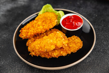 Chicken nuggets deep fried breaded food dish fresh tasty gourmet food background on the table rustic food top view copy space