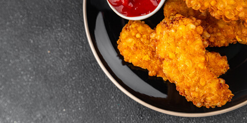Chicken nuggets deep fried breaded food dish fresh tasty gourmet food background on the table rustic food top view copy space