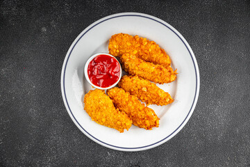 Chicken nuggets deep fried breaded food dish fresh tasty gourmet food background on the table rustic food top view copy space