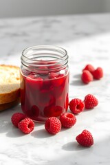 a glass mason jar filled with vibrant raspberry jam.