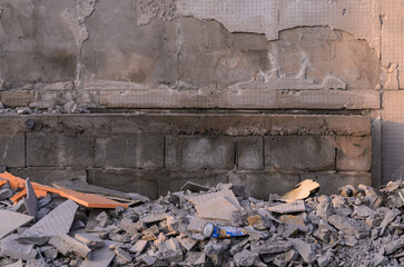 construction debris on the background of a damaged wall