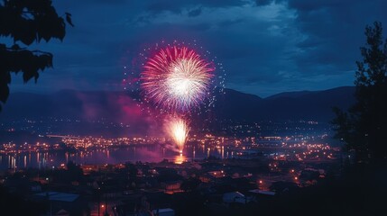 Colorful fireworks illuminate the night sky over a vibrant lakeside town during a festive celebration