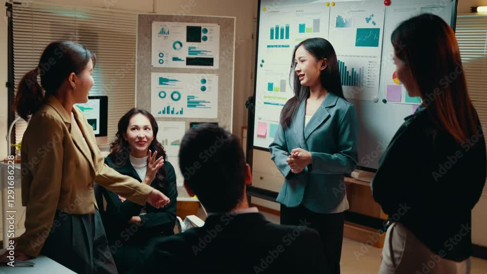 Poster business team discussing graphs and charts during a meeting