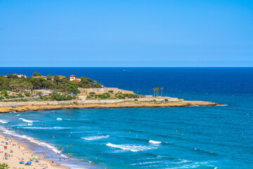 Beautiful view of Platja del Miracle beach in on the Dorada coast with    blue sea and sky in...